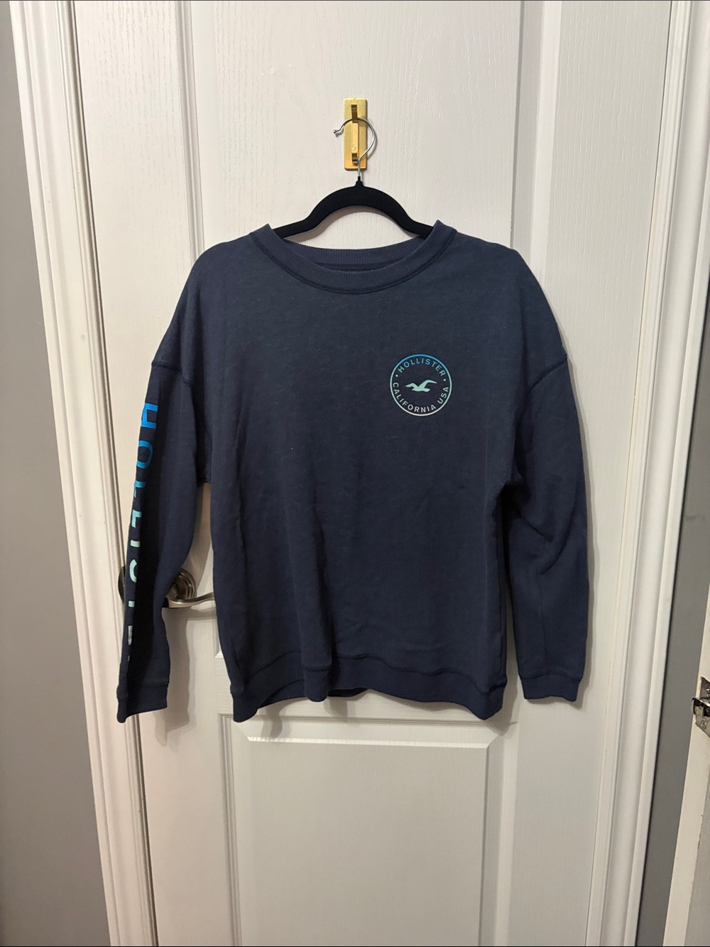Hollister women’s Navy Crewneck with Teal Logo